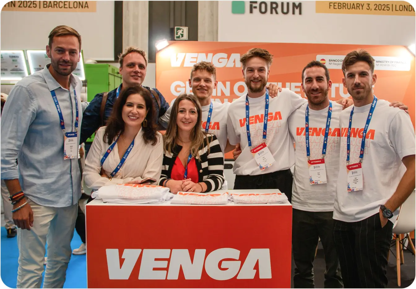 Venga team celebration with banner